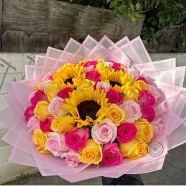 Bouquet of yellow sunflowers and pink, yellow, and blush roses