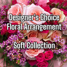 Pink and peach roses with purple filler flowers in a bouquet.