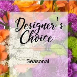 Colorful mixed flowers with a "Designer’s Choice" sign