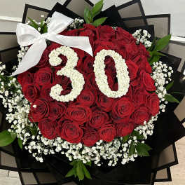 Red rose bouquet with white floral "30" and a white bow