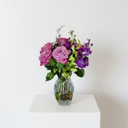 Lavender Bliss/ Lavender Roses, Purple Stock and Green Jade Orchids)