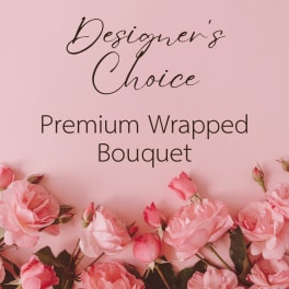 Pink roses arranged around text on a blush background