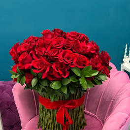 Large bouquet of red roses with a red ribbon