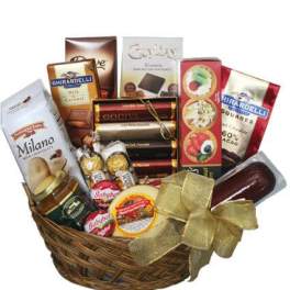 Basket of assorted chocolates and candy bars with a gold ribbon