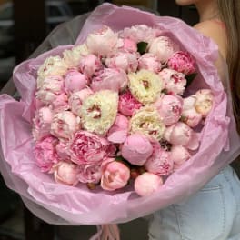 Large bouquet of pink peonies wrapped in pink paper
