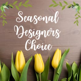 Yellow tulips beneath the words Seasonal Designers Choice