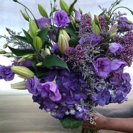 Purple bouquet with lilies, lisianthus, and hydrangeas