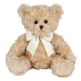 Cream teddy bear with a white ribbon bow