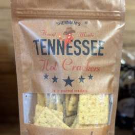 A bag of Sherman’s Tennessee hot crackers on a wooden surface.