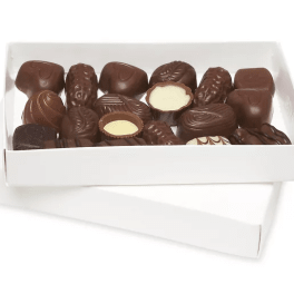Box of assorted chocolates in a white tray