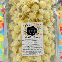 Bag of dill pickle gourmet popcorn with a colorful label