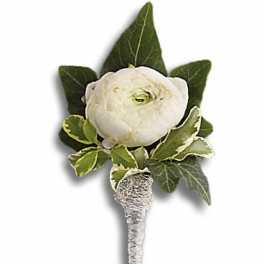 White flower boutonniere with green leaves and silver-wrapped stem