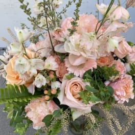 Pastel bouquet of roses, gerbera daisies, and mixed blooms