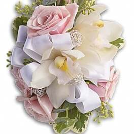 Pink roses and white orchids with a white ribbon bow