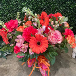 Bright mixed bouquet with orange gerbera daisies and pink flowers