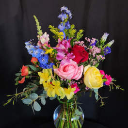 Colorful mixed bouquet in a clear glass vase