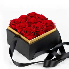 Box of red roses with a black ribbon