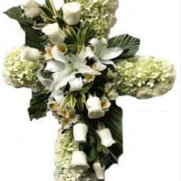 White floral cross arrangement with lilies and roses