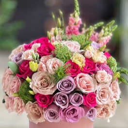 Pink hatbox arrangement of roses and carnations