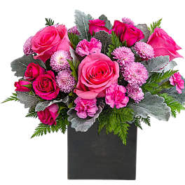 Pink roses and carnations in a black rectangular vase