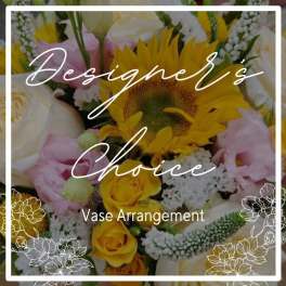 Mixed bouquet with sunflowers, yellow roses, and pink blooms