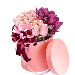 Pink roses and purple orchids in a round pink box with ribbon