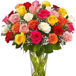 Mixed roses in a clear glass vase