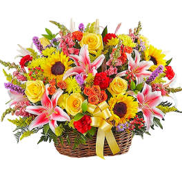 Basket of mixed flowers with lilies, roses, and sunflowers