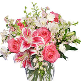 Pink and white mixed flower bouquet in a clear glass vase