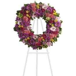 Colorful floral wreath on a white easel