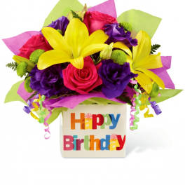 Bright mixed bouquet in a Happy Birthday vase