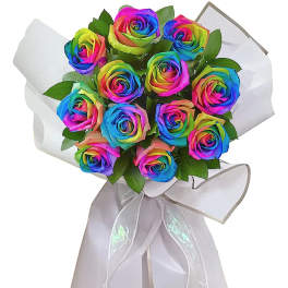 Bouquet of rainbow-colored roses wrapped in white paper with a ribbon