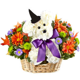 White dog-shaped flower basket with a purple bow and autumn blooms