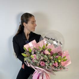 Large pink bouquet with a clear birthday balloon