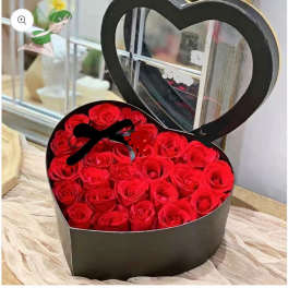 Heart-shaped box filled with red roses