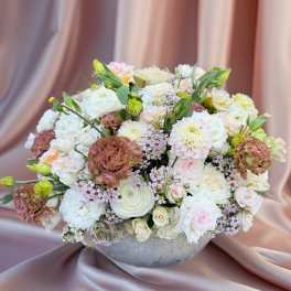 Large pastel bouquet in a gray bowl vase