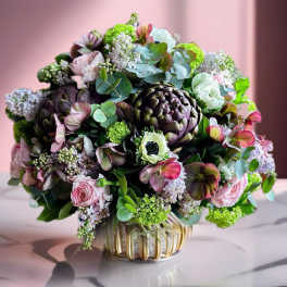 Bouquet of pink and green flowers in a glass vase