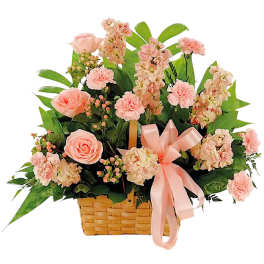 Pink flowers arranged in a wicker basket with a satin ribbon