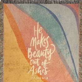 Rainbow wall hanging with the words "He makes beauty out of ashes"