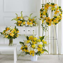 Yellow and white floral funeral set with a wreath and vase arrangements
