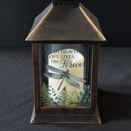 Decorative lantern with a candle and memorial text