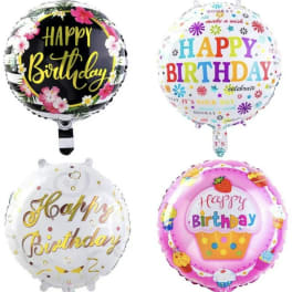 Four round birthday balloons with colorful printed messages