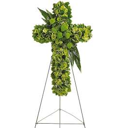 Green floral cross on a metal easel