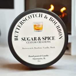 Round candle tin labeled Butterscotch & Bourbon.
