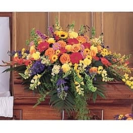 Large colorful floral casket spray with roses and daisies
