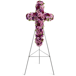 Purple and pink floral cross on a metal stand