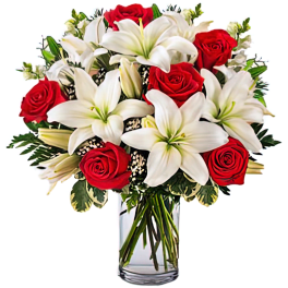 Red roses and white lilies arranged in a clear glass vase