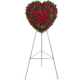 Heart-shaped red rose standing spray on an easel