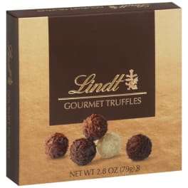 Square gold and brown Lindt gourmet truffles box with assorted chocolate truffles pictured on the front
