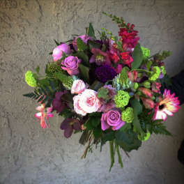 Mixed bouquet of pink, purple, and green flowers